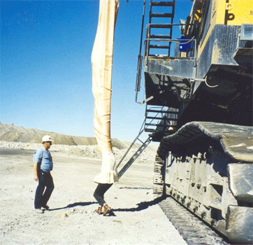 Ruggedized mining machine escape chute installed on an excavator cabin deck frame.
